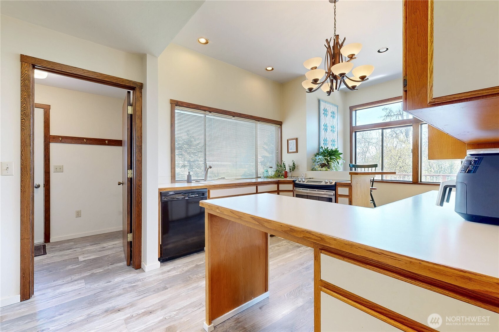 457 Prospect Avenue Walla Walla, WA 99362 - Photo 14 of 40 a large kitchen with kitchen island a large counter space a sink appliances and a window