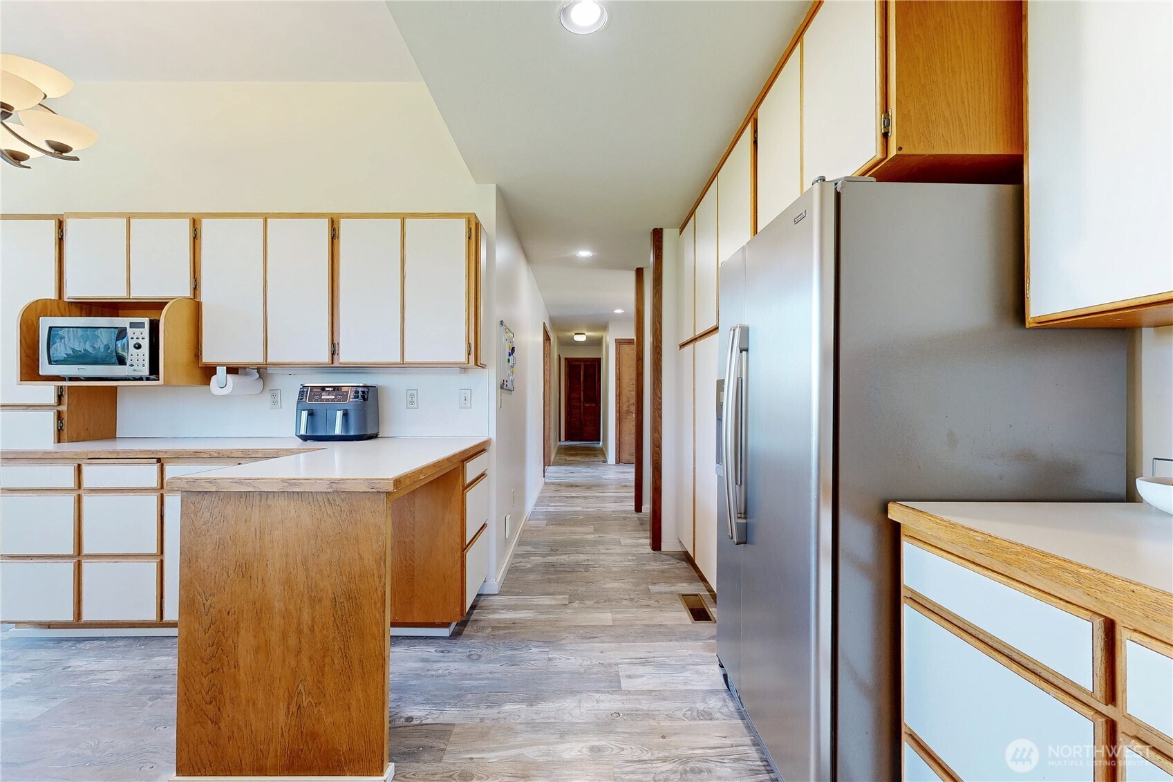 457 Prospect Avenue Walla Walla, WA 99362 - Photo 16 of 40 a large kitchen with stainless steel appliances a refrigerator and a stove