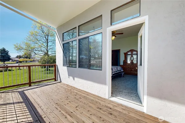 a view of a balcony with window
