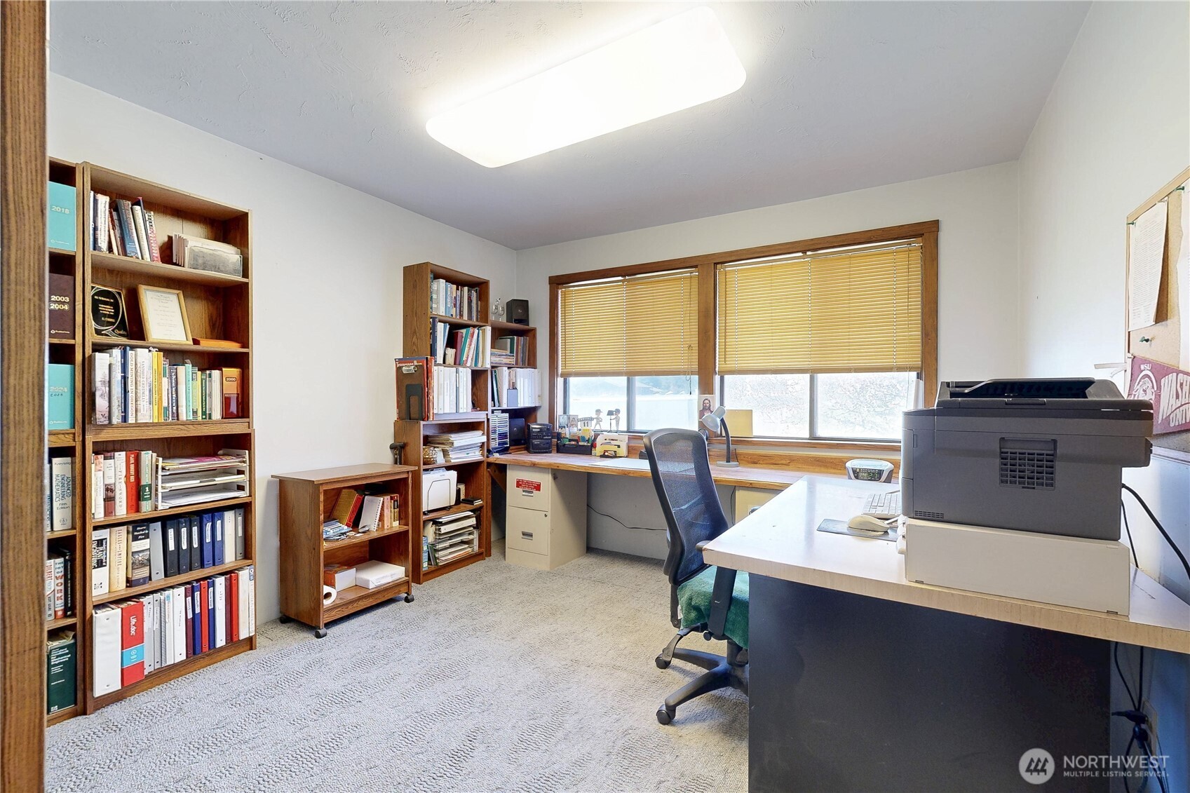 457 Prospect Avenue Walla Walla, WA 99362 - Photo 23 of 40 a view of a workspace with furniture and a bookshelf