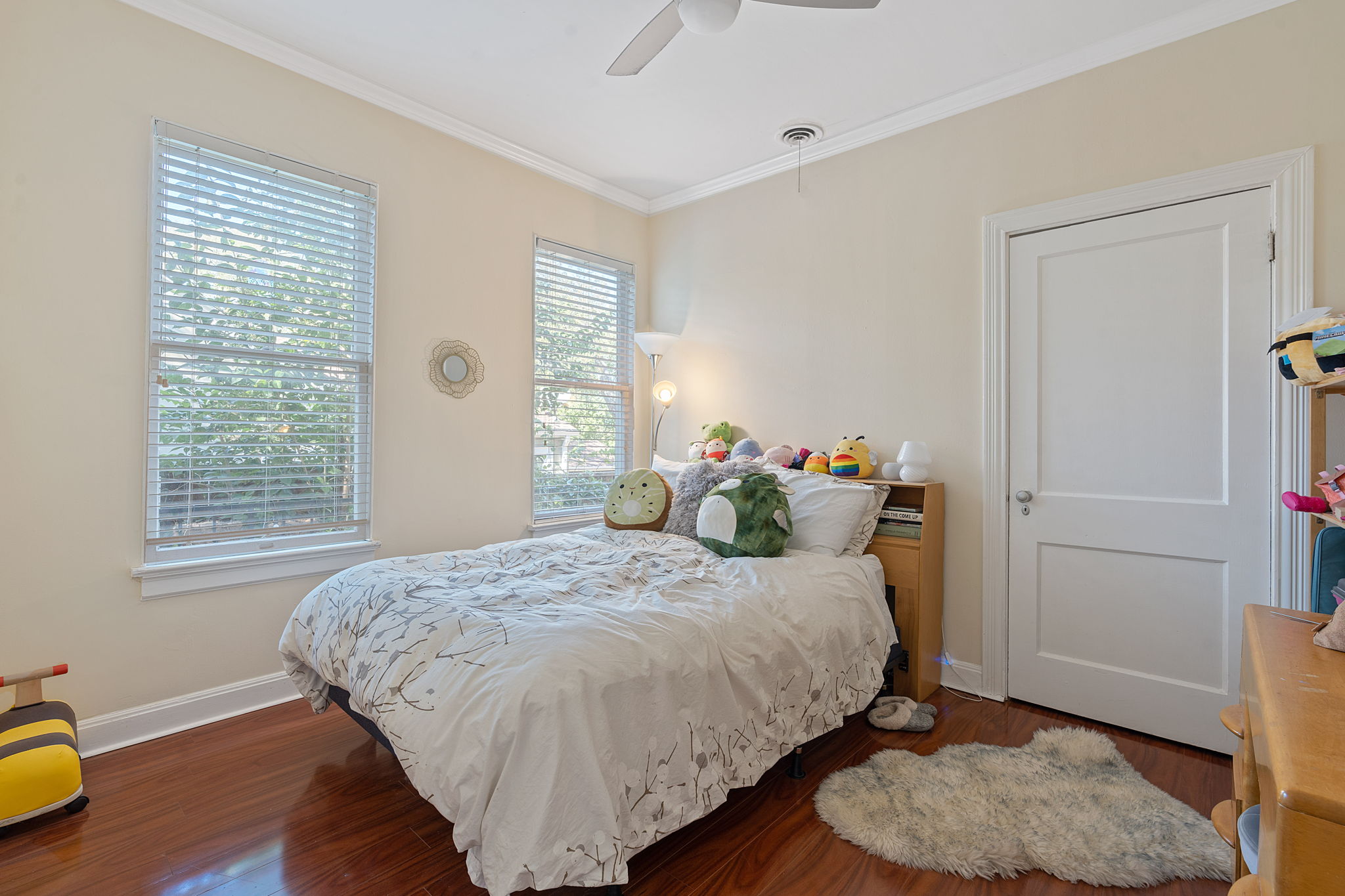 1700 Northwood Road Austin, TX 78703 - Photo 12 of 40 a bedroom with a bed and wooden floor