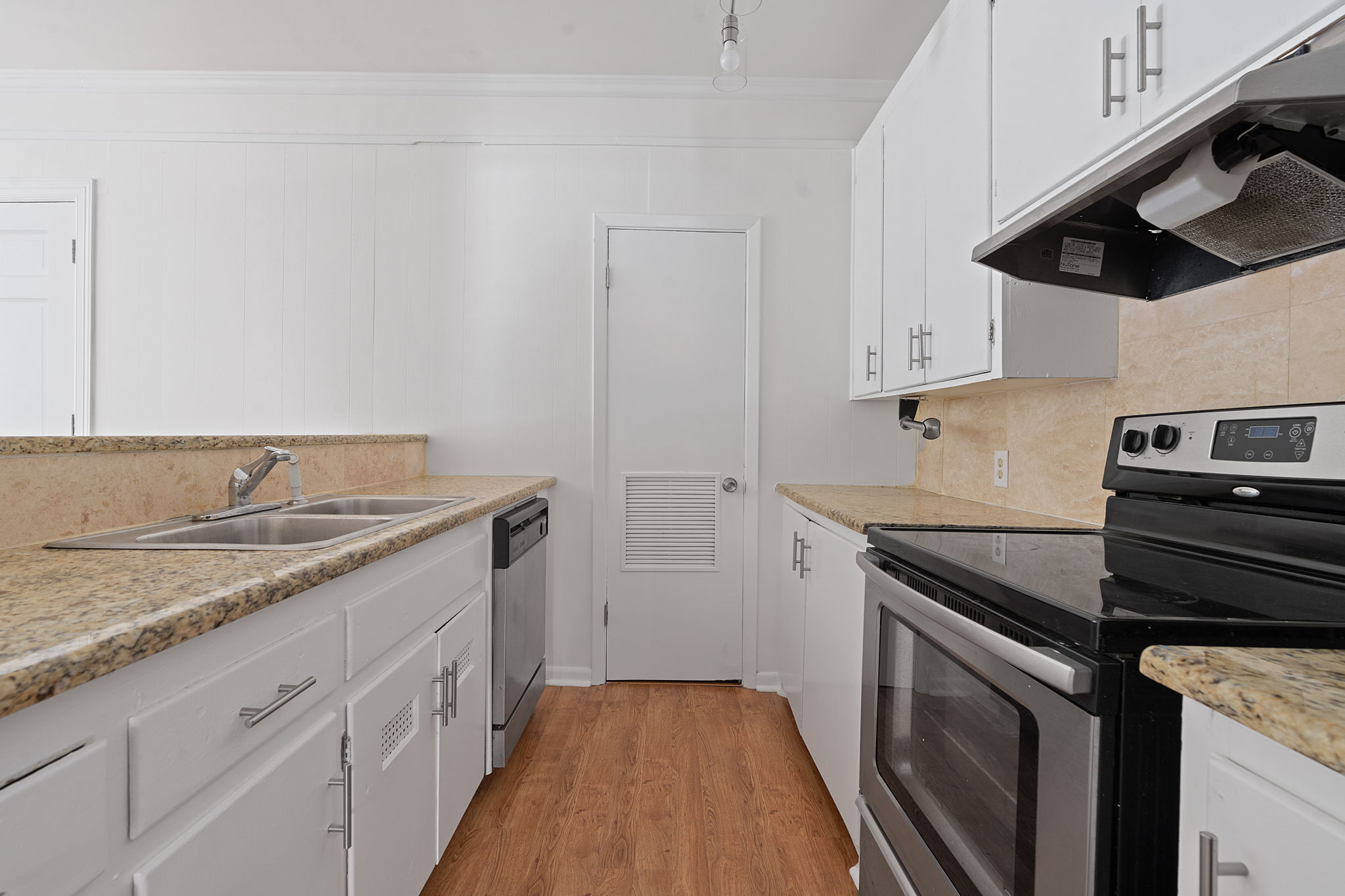 1700 Northwood Road Austin, TX 78703 - Photo 18 of 40 a kitchen with a sink and cabinets