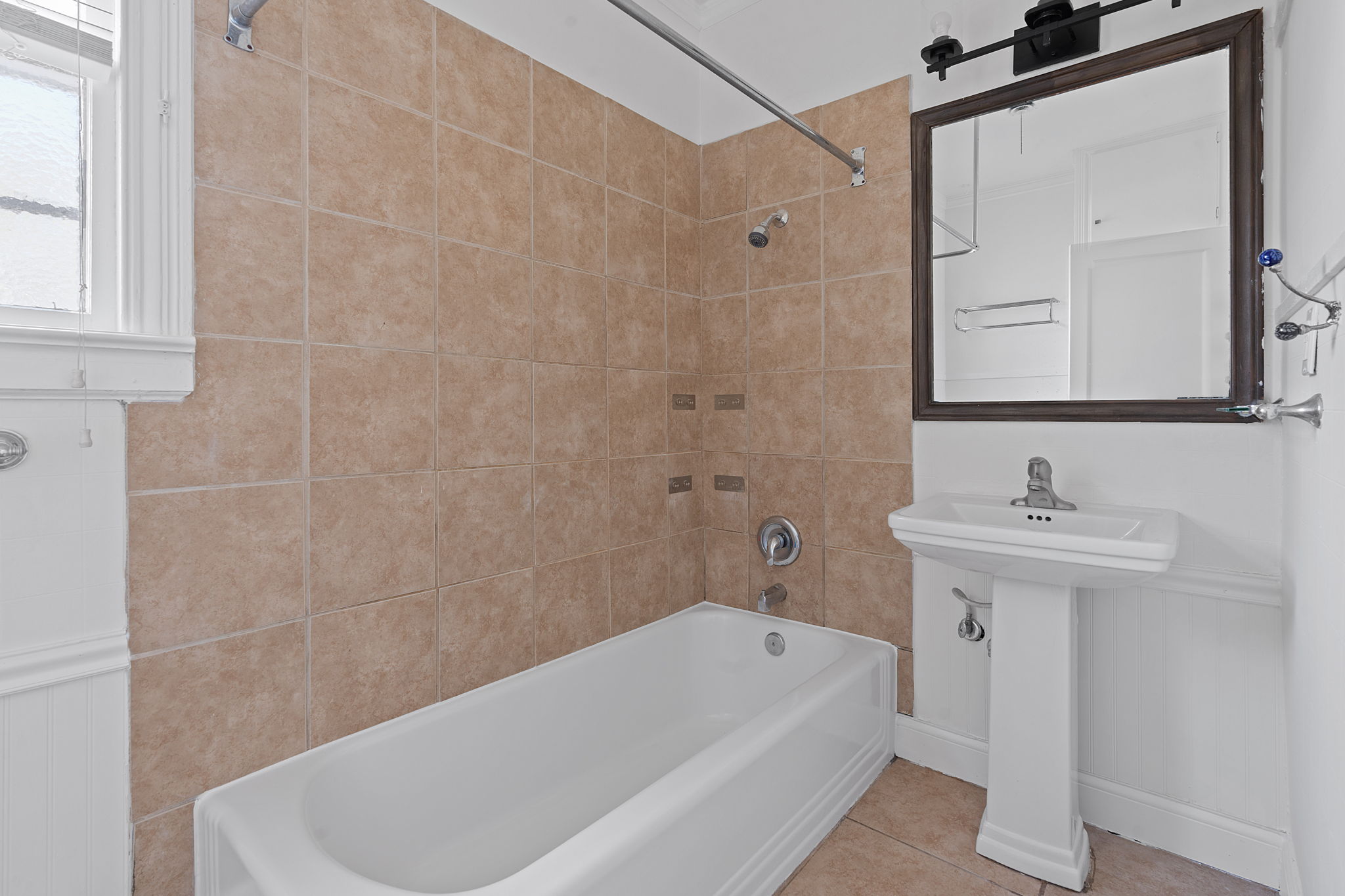 1700 Northwood Road Austin, TX 78703 - Photo 23 of 40 a bathroom with a sink a bathtub and a shower