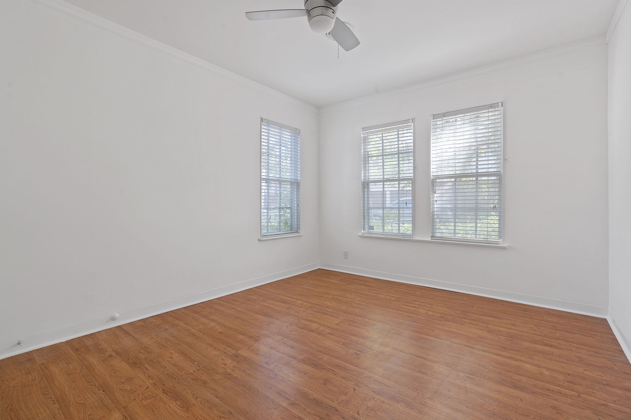1700 Northwood Road Austin, TX 78703 - Photo 24 of 40 an empty room with windows and fan