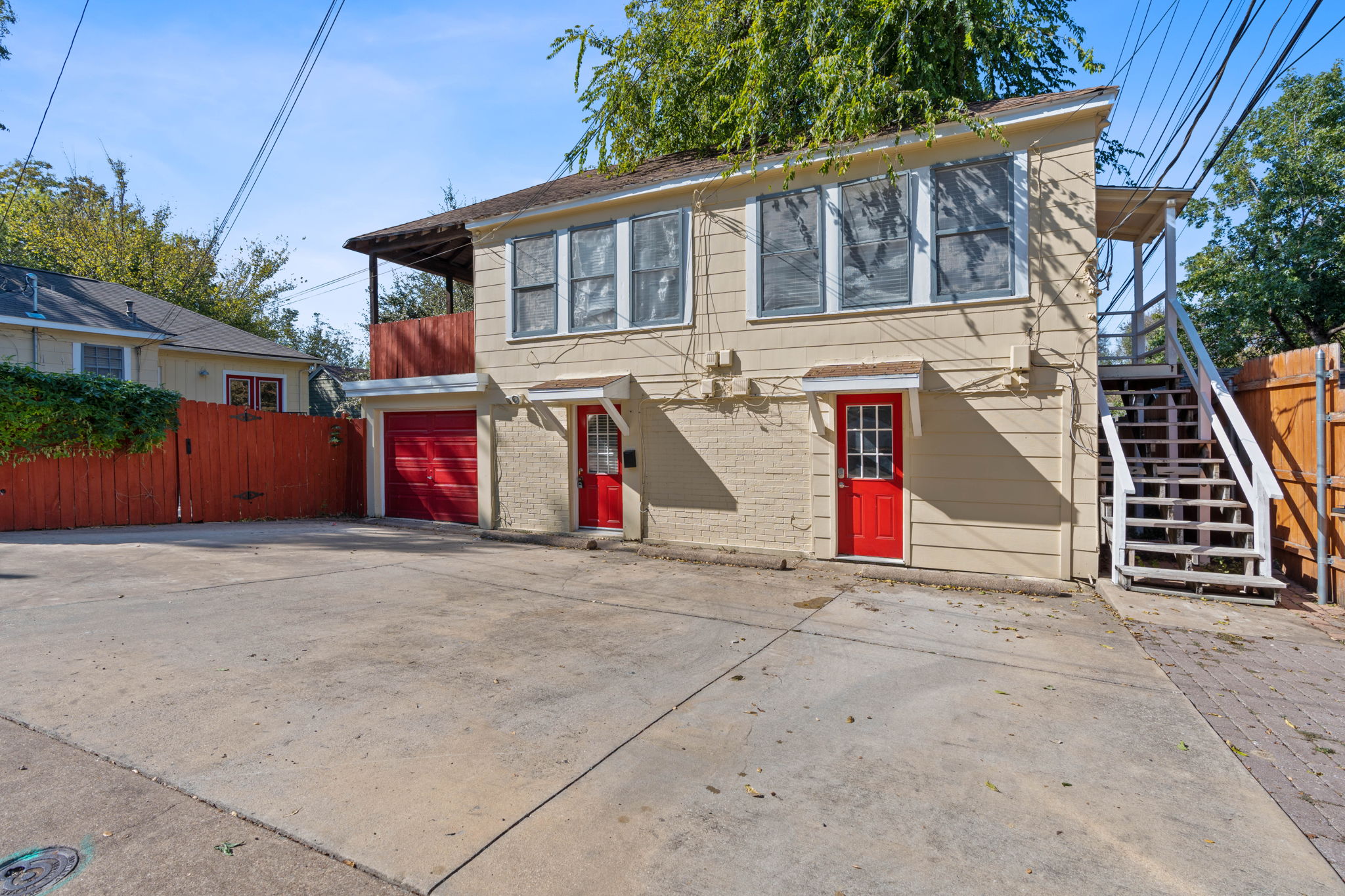 1700 Northwood Road Austin, TX 78703 - Photo 25 of 40 Jefferson Facing Duplex w/ stairs leading to 1/1 then door on right leading to laundry and door on the left leading to efficiency apt