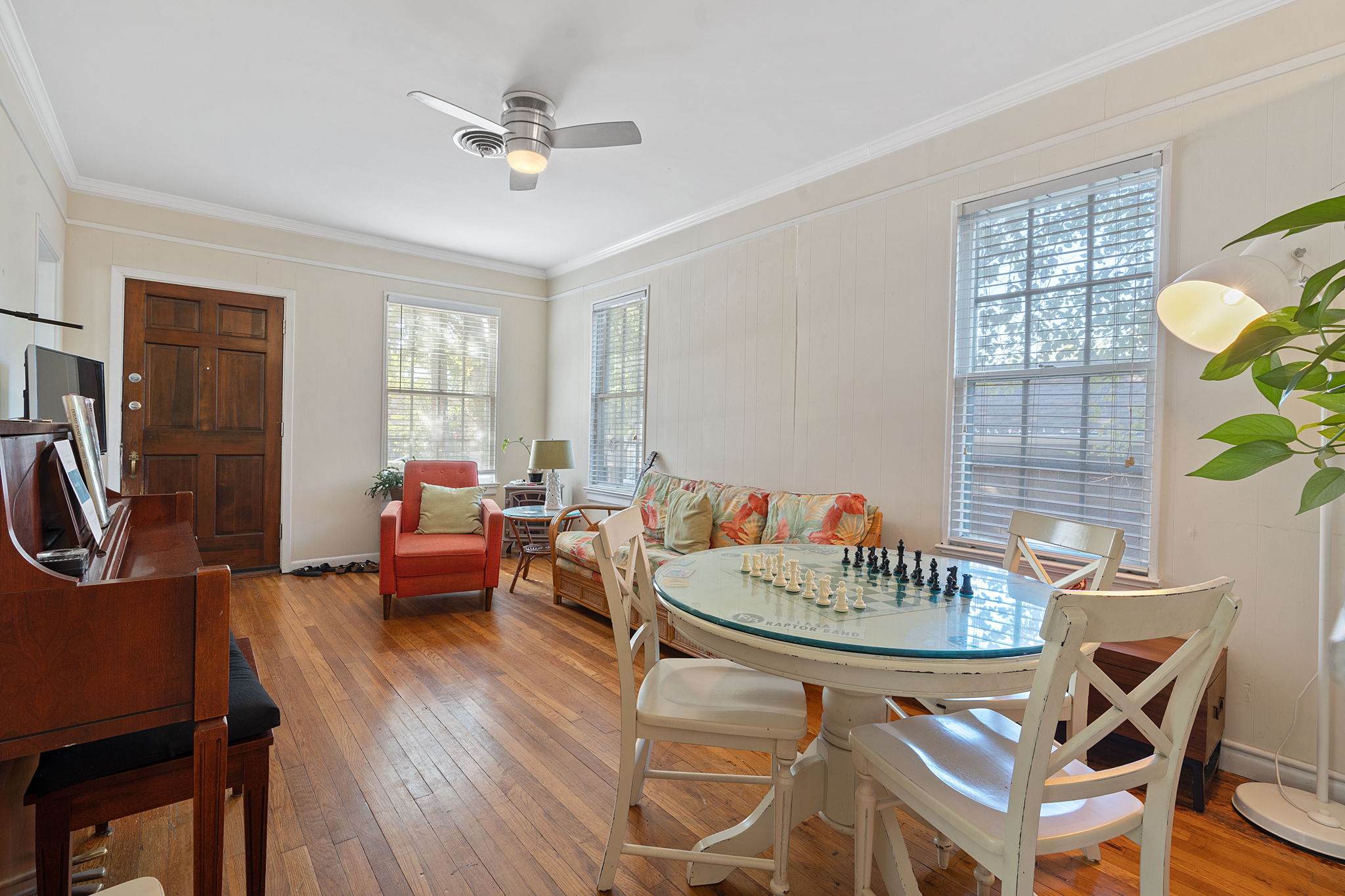 1700 Northwood Road Austin, TX 78703 - Photo 3 of 40 a living room with furniture a window and a chandelier
