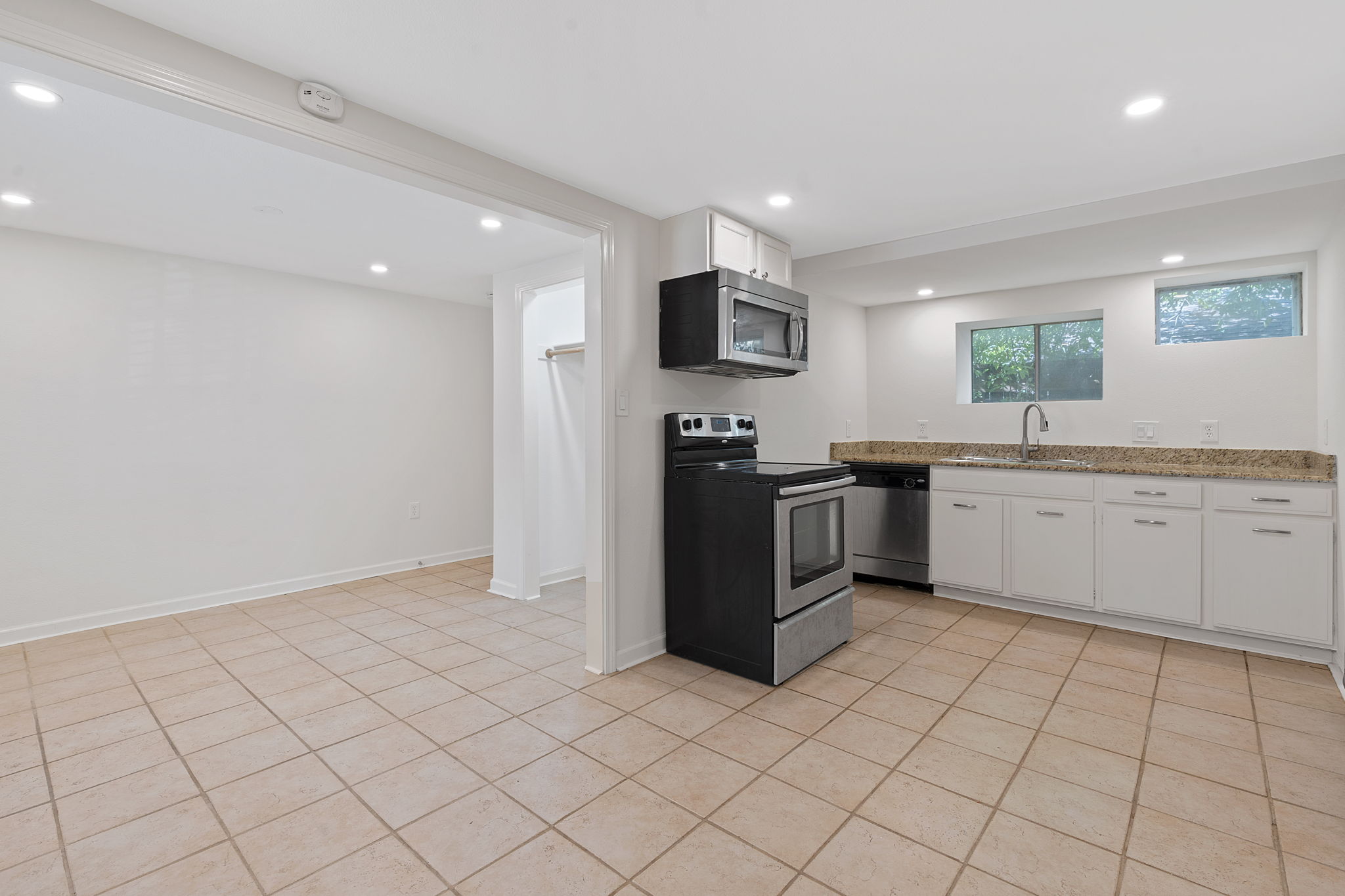 1700 Northwood Road Austin, TX 78703 - Photo 38 of 40 a kitchen with stainless steel appliances a sink and a refrigerator