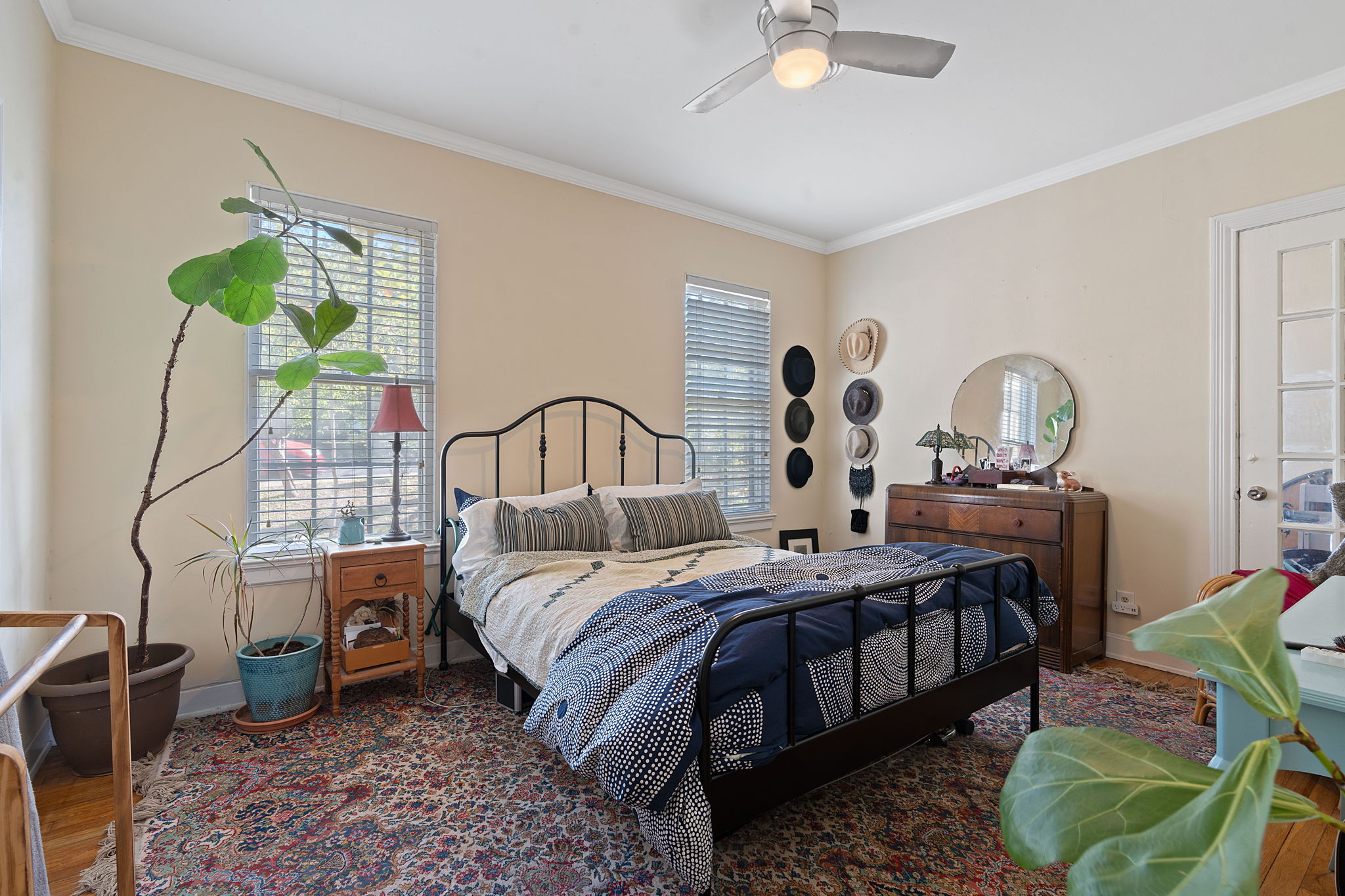 1700 Northwood Road Austin, TX 78703 - Photo 10 of 40 a bedroom with a bed a couch and dresser