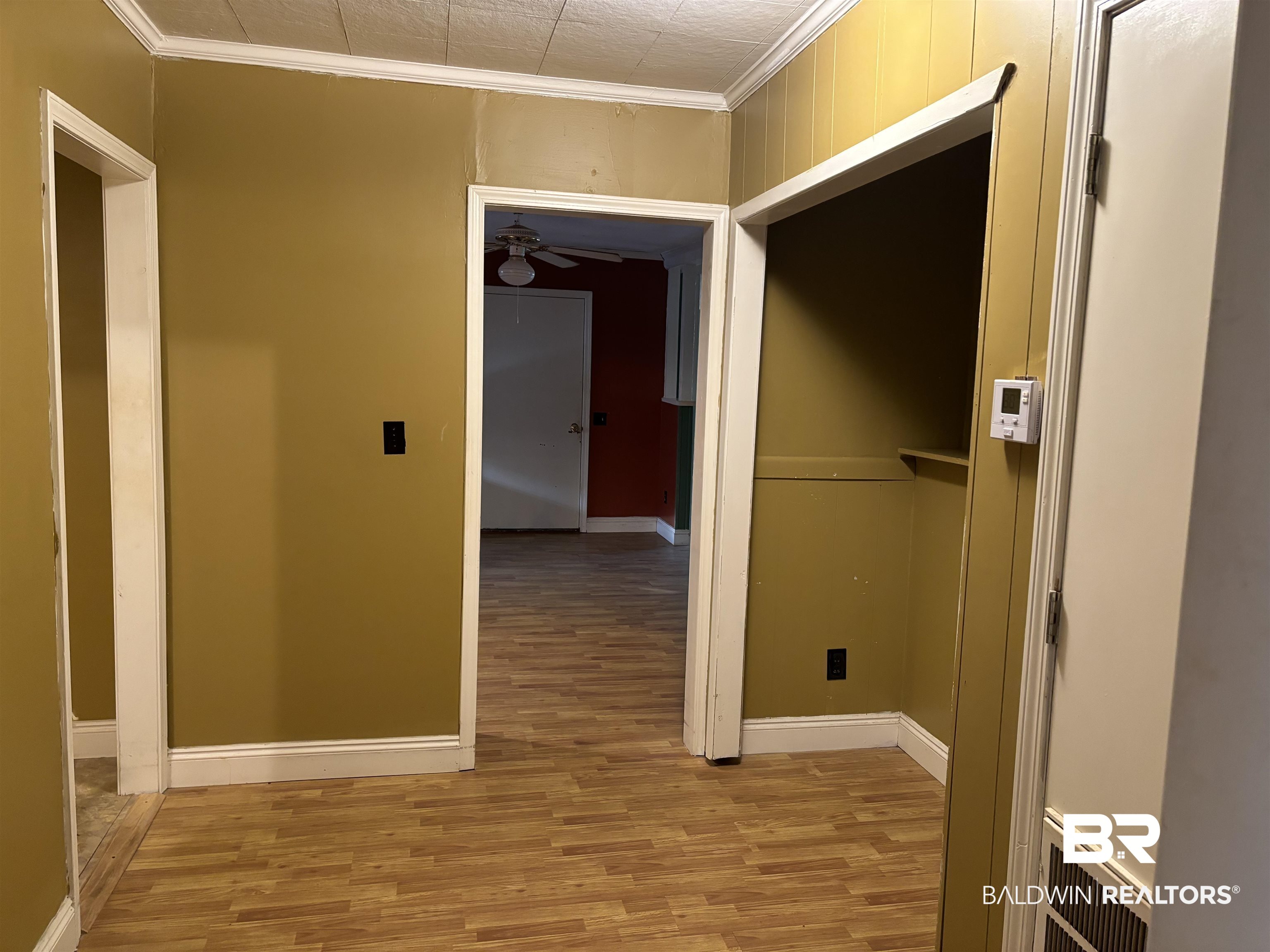 17495 County Road 48 Robertsdale, AL 36567 - Photo 27 of 37 Corridor featuring crown molding and hardwood / wood-style floors