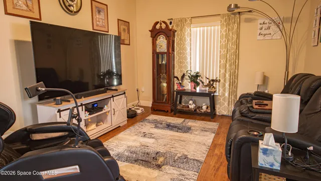 a bedroom with window closet and a mirror