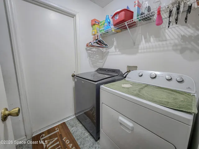 a utility room with dryer and washer