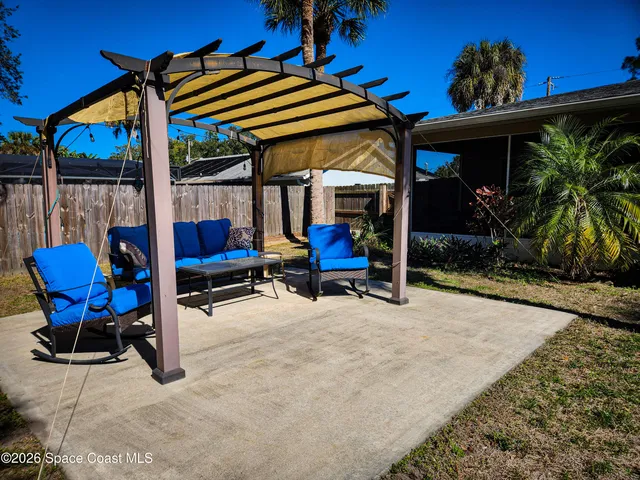 a view of chairs and tables in patio