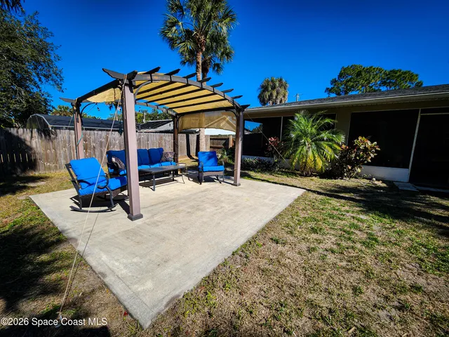 a view of a chairs and tables in patio