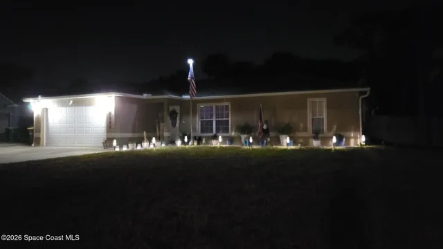 a view of an chairs and table in patio