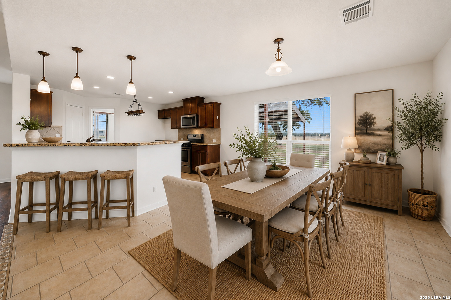 12897 La Vernia Road St. Hedwig, TX 78152 - Photo 12 of 34 a view of a dining room with furniture and wooden floor