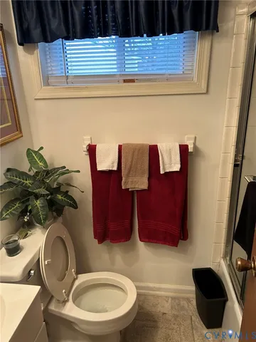 a bathroom with a toilet and a sink