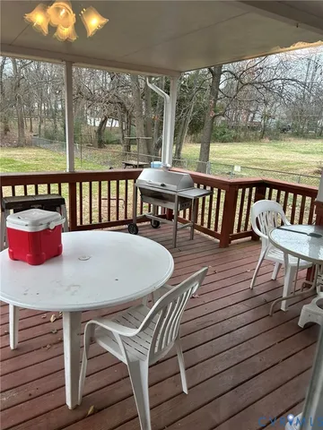 a view of a chairs and table on the deck