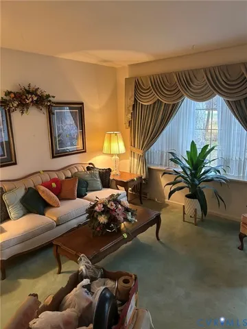 a living room with furniture and a table