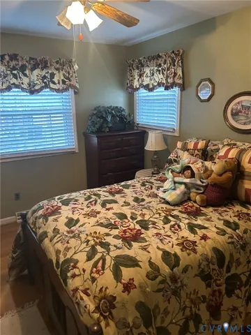 a bedroom with a bed and a mirror