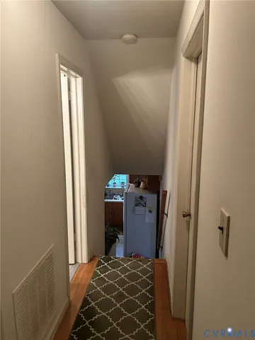 a bedroom with a bed and a mirror