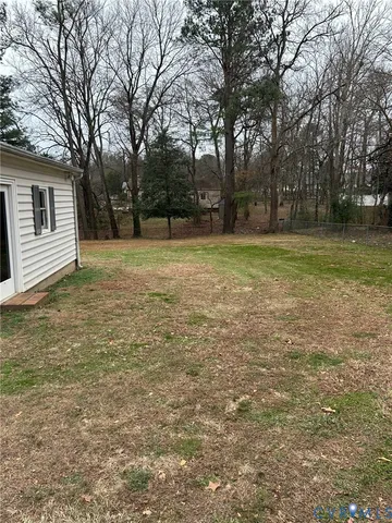 a view of outdoor space with deck and yard