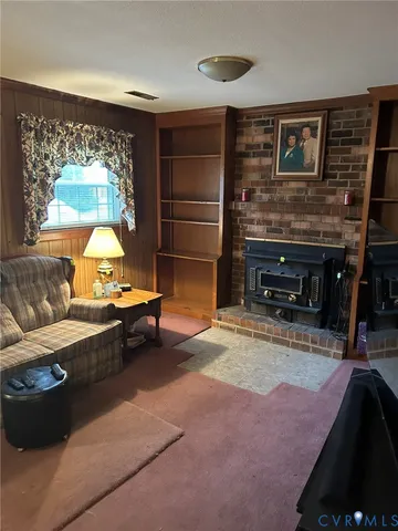a room with furniture and a fireplace