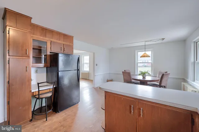 a kitchen with stainless steel appliances a refrigerator and a sink