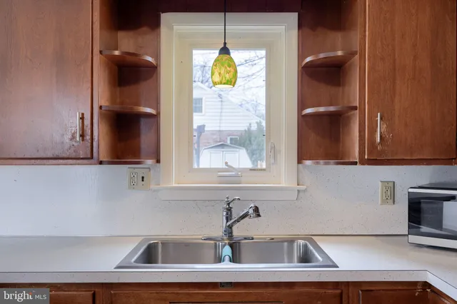 a kitchen with a sink and a window