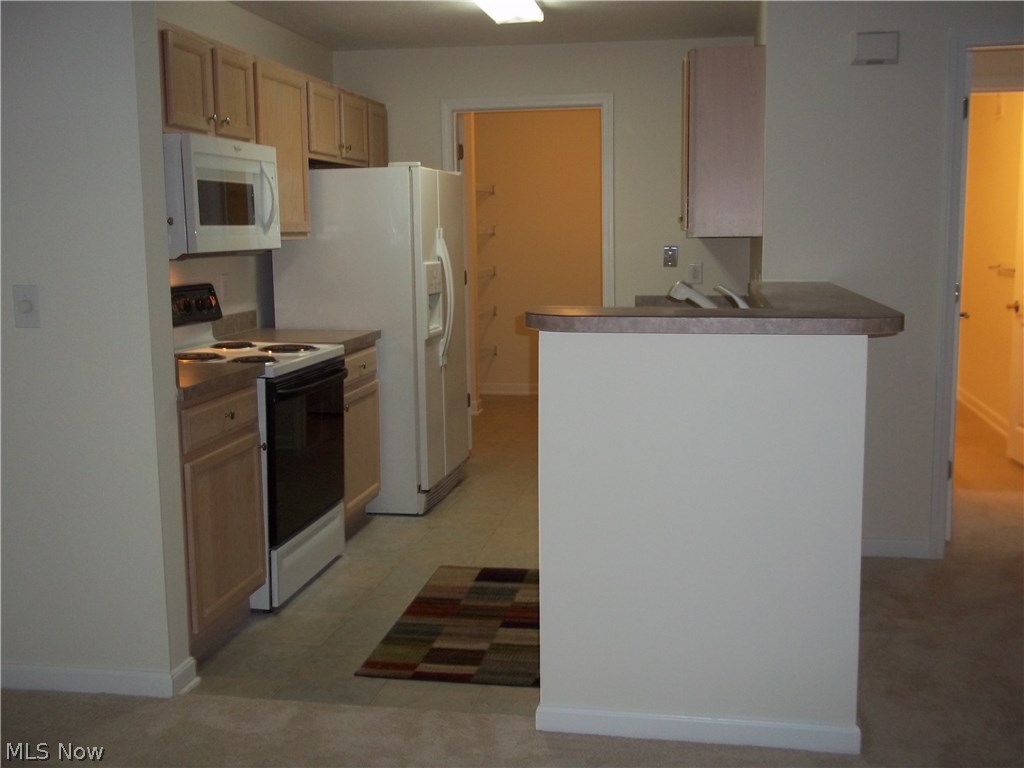 28340 Center Ridge Road, Unit 126 Westlake, OH 44145 - Photo 8 of 13 Kitchen through to the utility room.