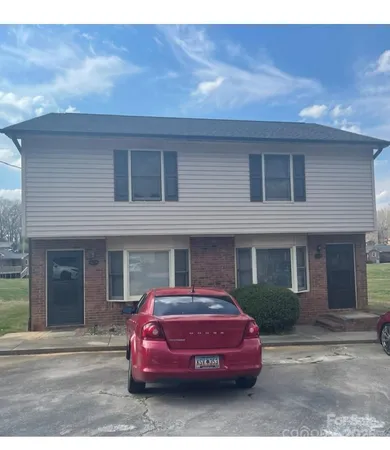 a car parked in front of a house