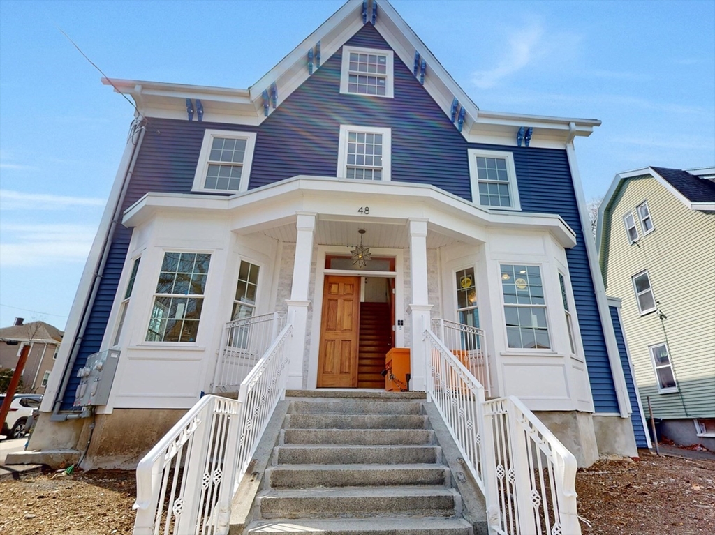 48 Rockwell Street, Unit 1 Malden, MA 02148 - Photo 2 of 34 a view of a brick house with large windows