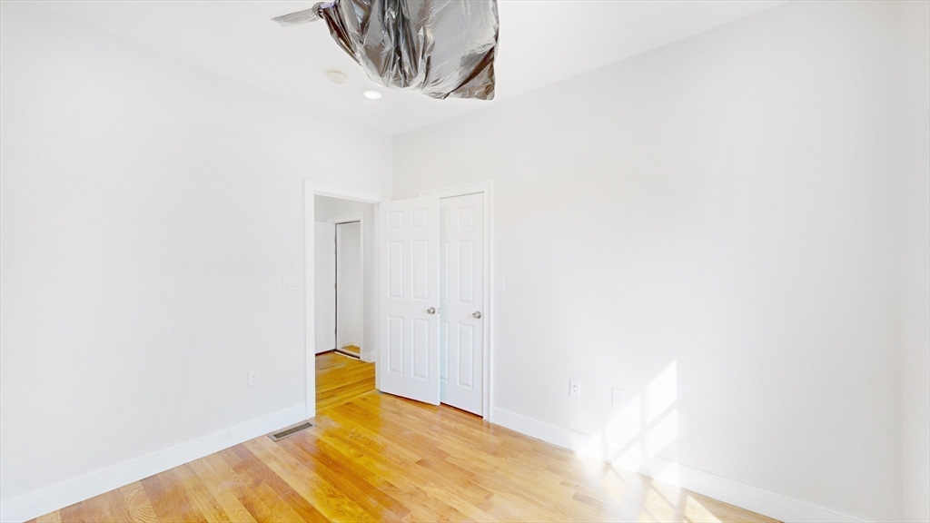 48 Rockwell Street, Unit 1 Malden, MA 02148 - Photo 22 of 34 a view of a room with wall painting and stairs