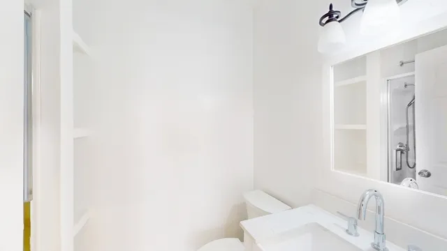 a bathroom with a toilet and sink