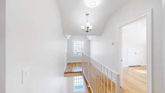 a view of a hallway with windows