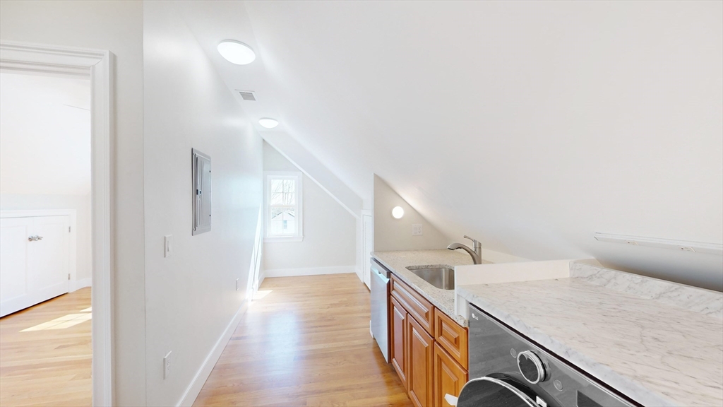 48 Rockwell Street, Unit 1 Malden, MA 02148 - Photo 27 of 34 a view of a hallway with stairs