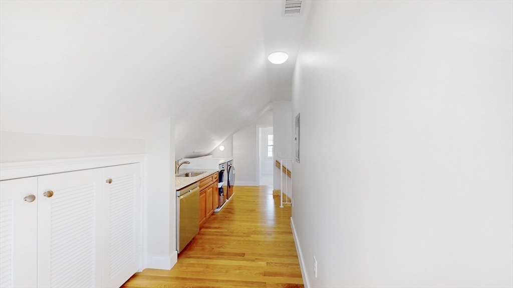 48 Rockwell Street, Unit 1 Malden, MA 02148 - Photo 29 of 34 a view of a hallway with wooden floor