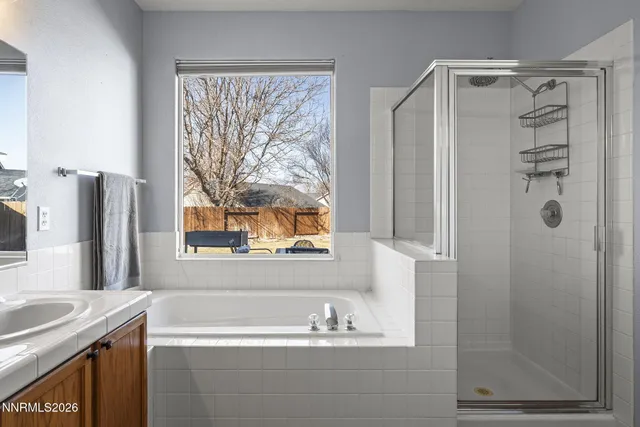 a bathroom with a bathtub and a sink