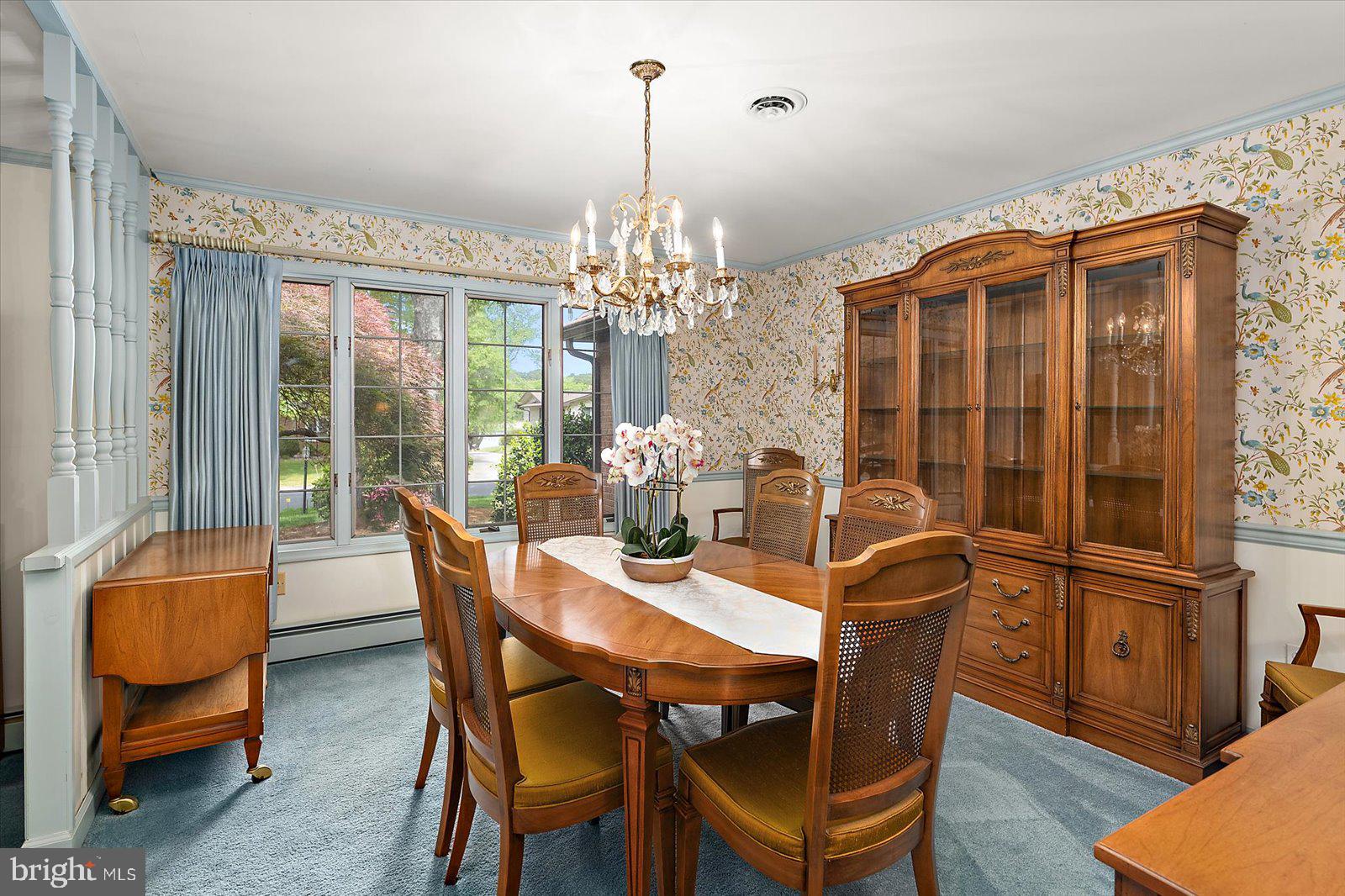 701 Riverside Pines Court Salisbury, MD 21801 - Photo 11 of 81 a dining room with furniture a chandelier and wooden floor