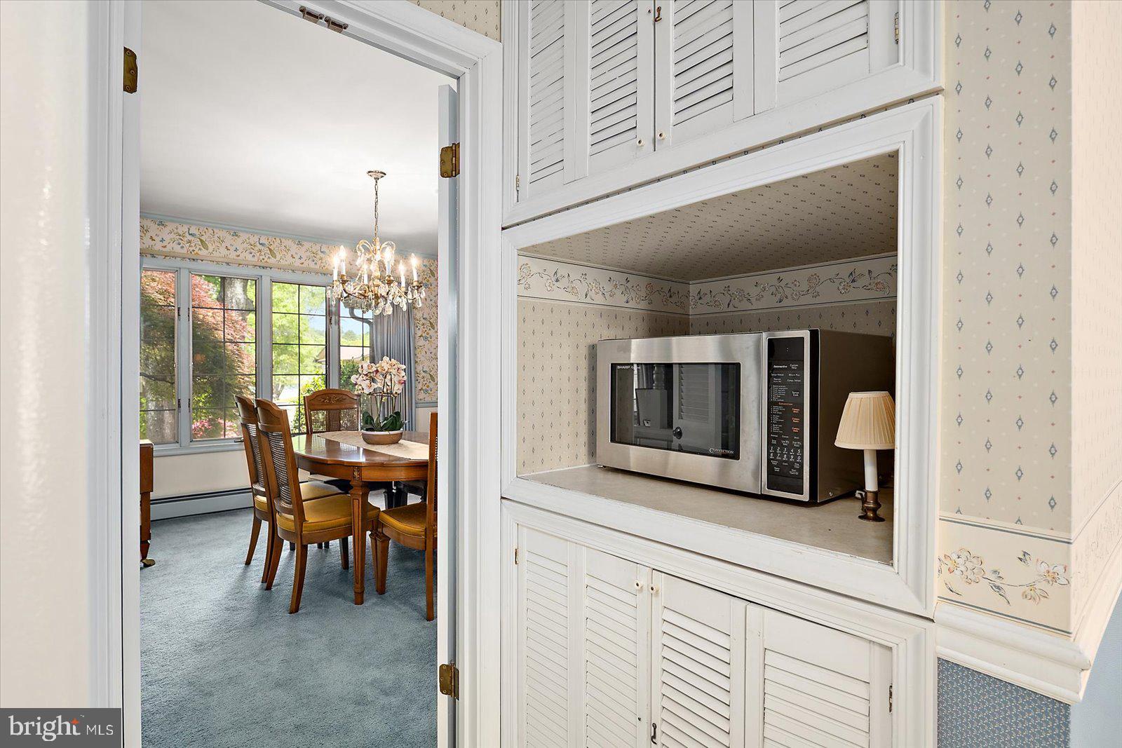701 Riverside Pines Court Salisbury, MD 21801 - Photo 15 of 81 a dining room with furniture and a floor to ceiling window