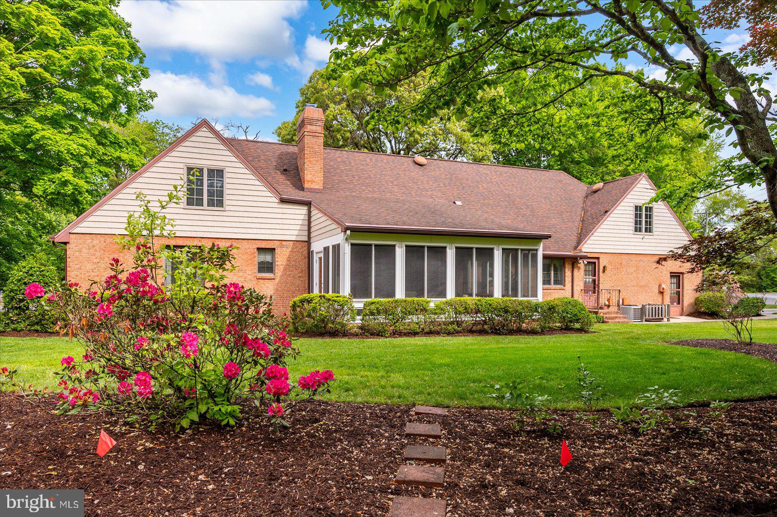 701 Riverside Pines Court Salisbury, MD 21801 - Photo 2 of 81 a front view of a house with a big yard and potted plants