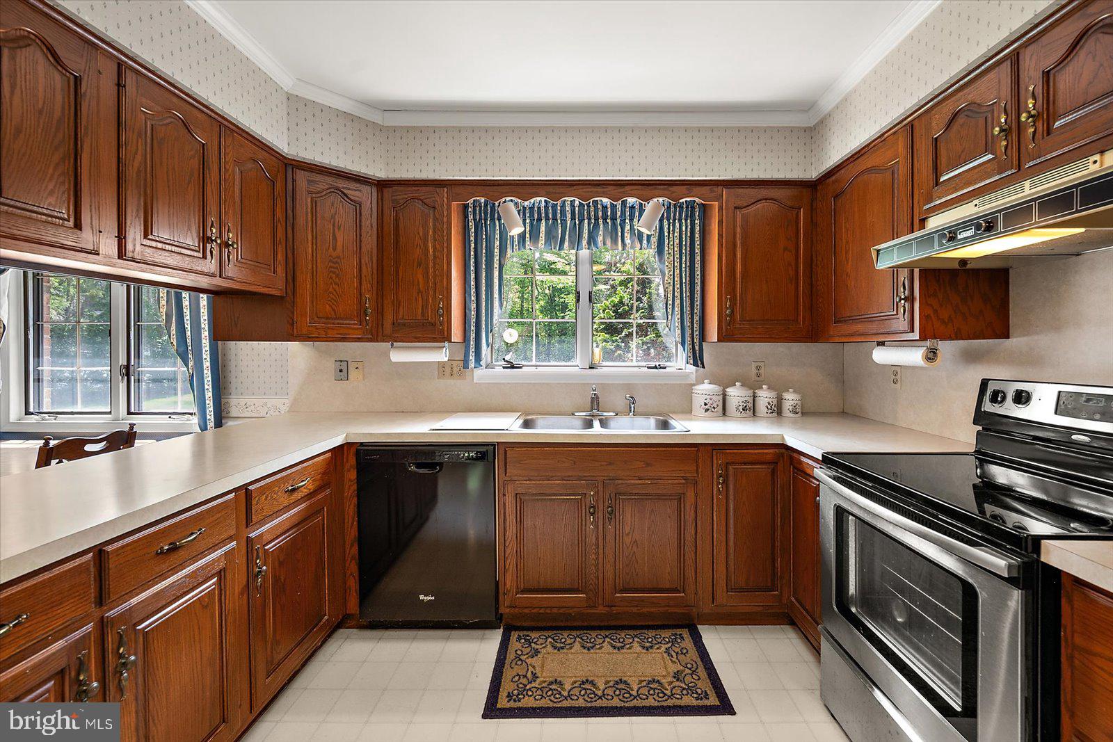 701 Riverside Pines Court Salisbury, MD 21801 - Photo 30 of 81 a kitchen with a sink stove top oven and cabinets