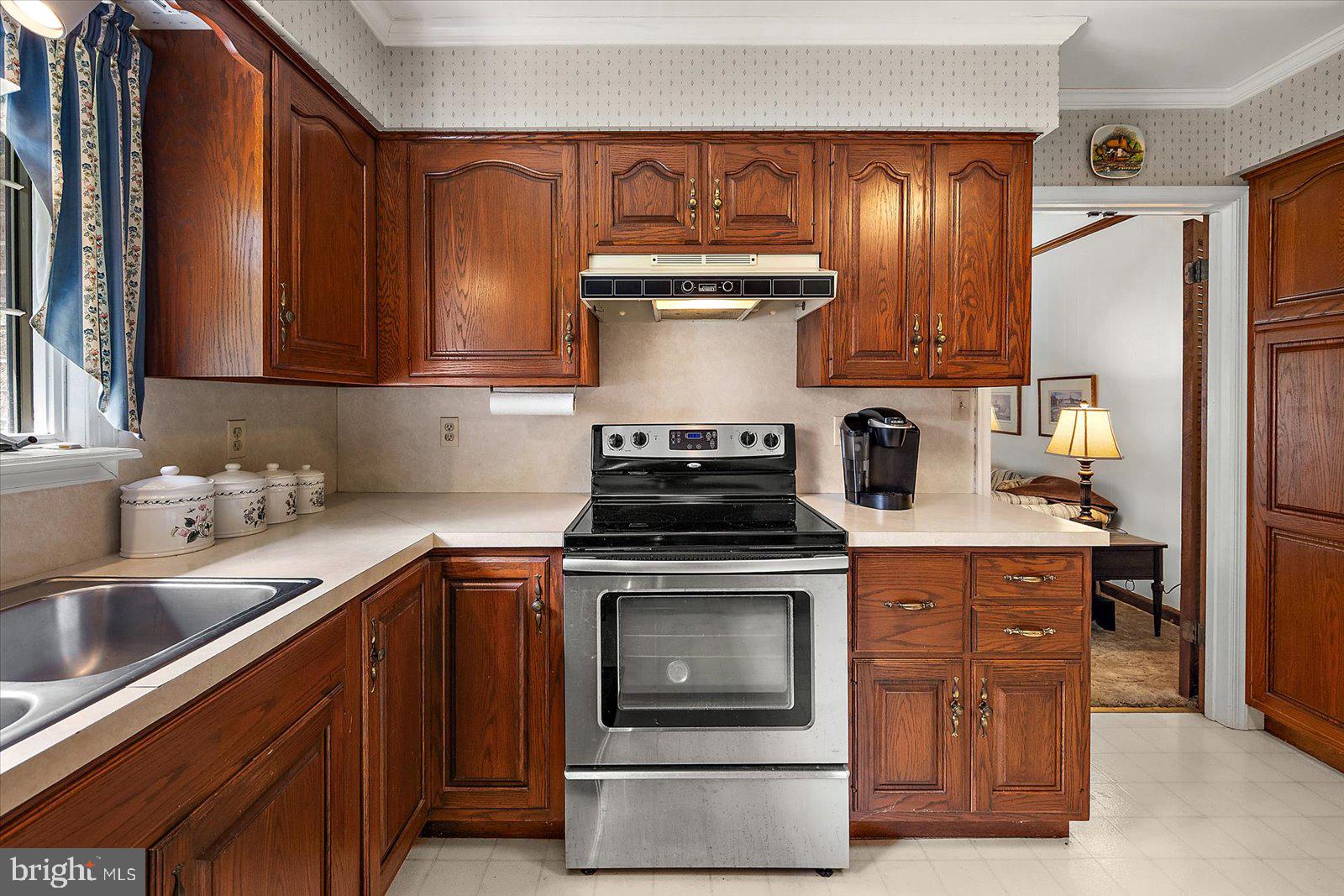 701 Riverside Pines Court Salisbury, MD 21801 - Photo 33 of 81 a kitchen with stainless steel appliances granite countertop a stove a sink and a refrigerator