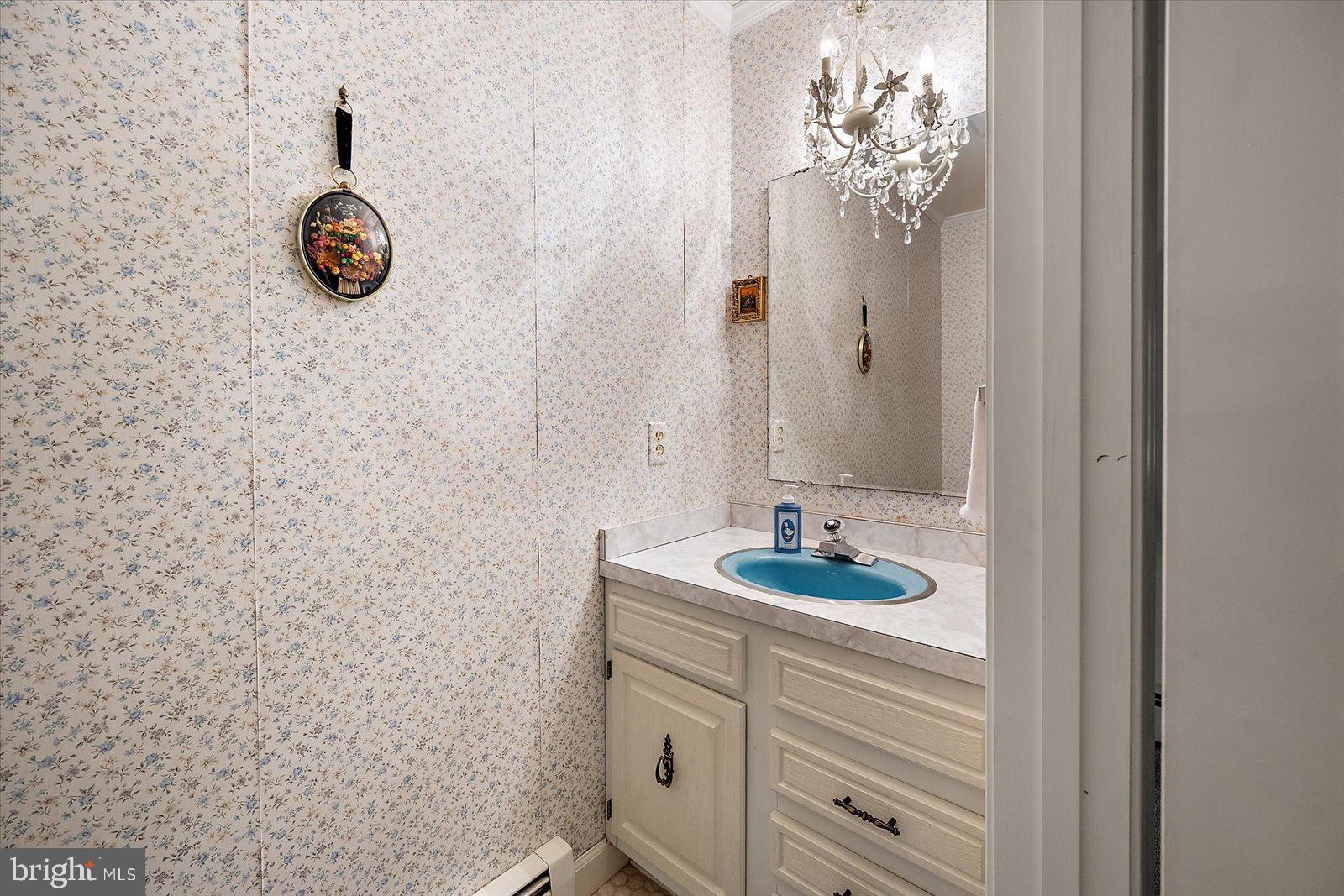 701 Riverside Pines Court Salisbury, MD 21801 - Photo 45 of 81 a bathroom with a sink a vanity and a mirror