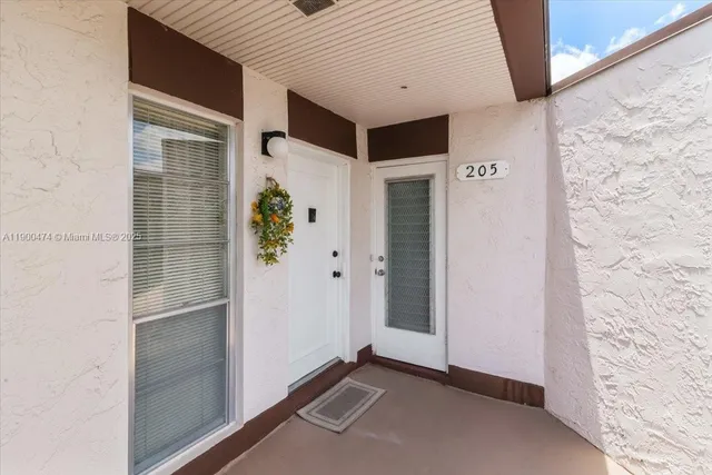 $230,000 | 7 Greenway Village North, Unit 205, Royal Palm Beach, FL 33411