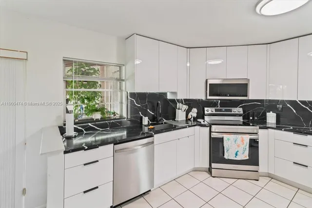 $230,000 | 7 Greenway Village North, Unit 205, Royal Palm Beach, FL 33411