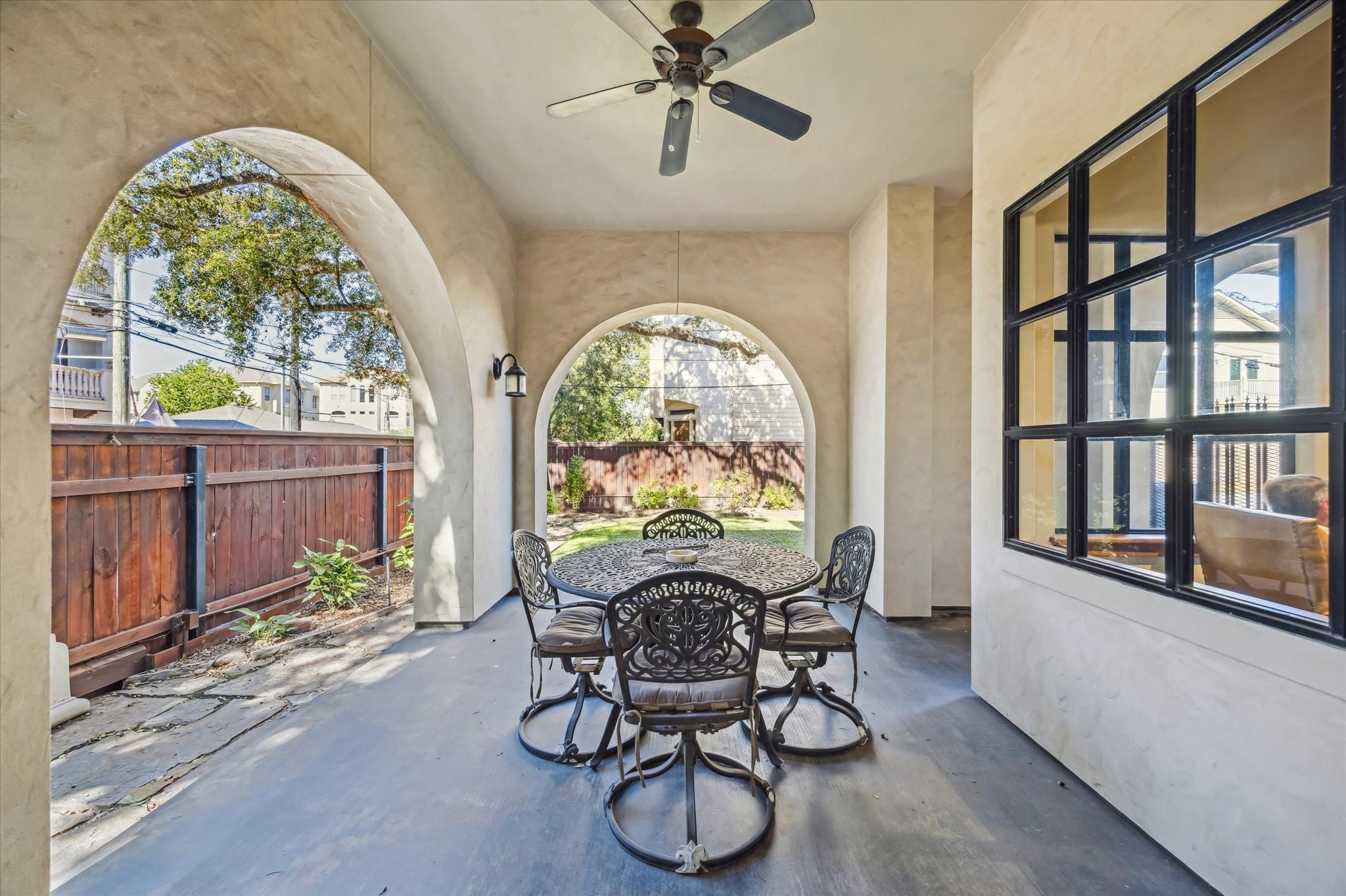 4320 Dickson Street Houston, TX 77007 - Photo 14 of 47 a dining room with wooden floor a livingroom with furniture a floor to ceiling windows and a rug