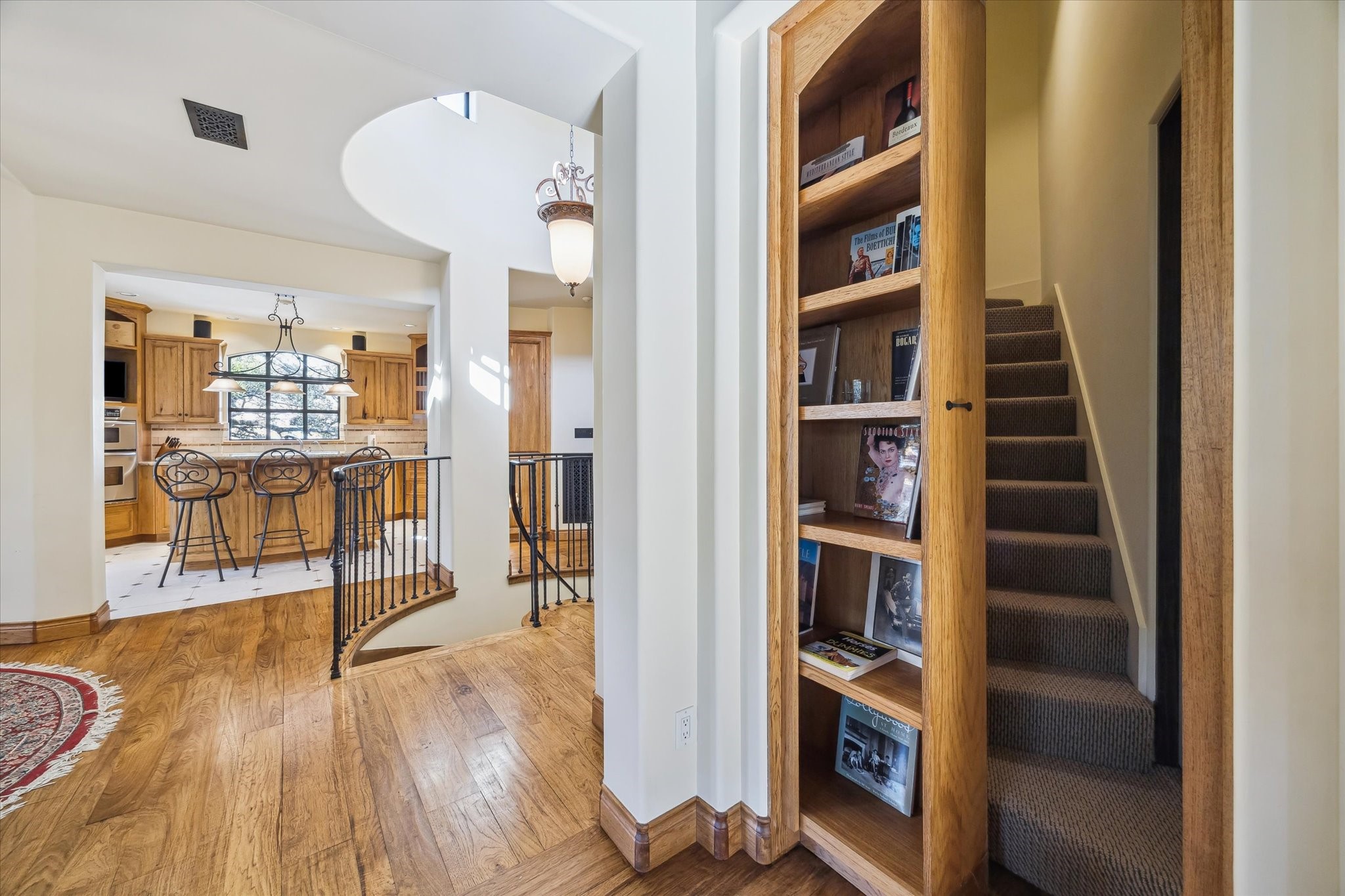 4320 Dickson Street Houston, TX 77007 - Photo 21 of 47 Sliding bookcase reveals hidden staircase that leads to 3rd floor billiards room.