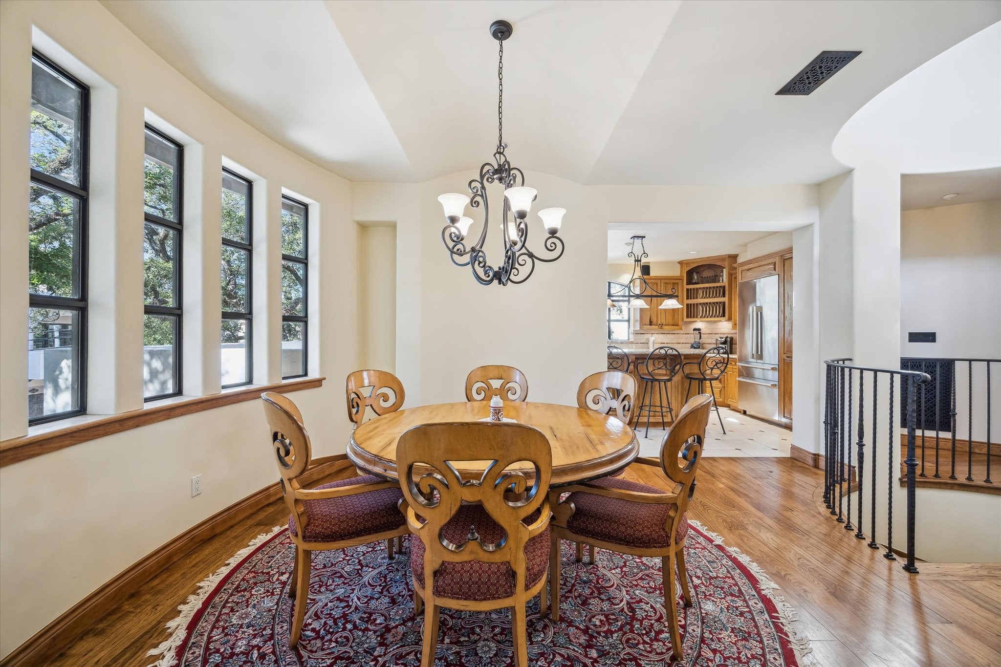 4320 Dickson Street Houston, TX 77007 - Photo 22 of 47 a dining room with furniture a chandelier and wooden floor