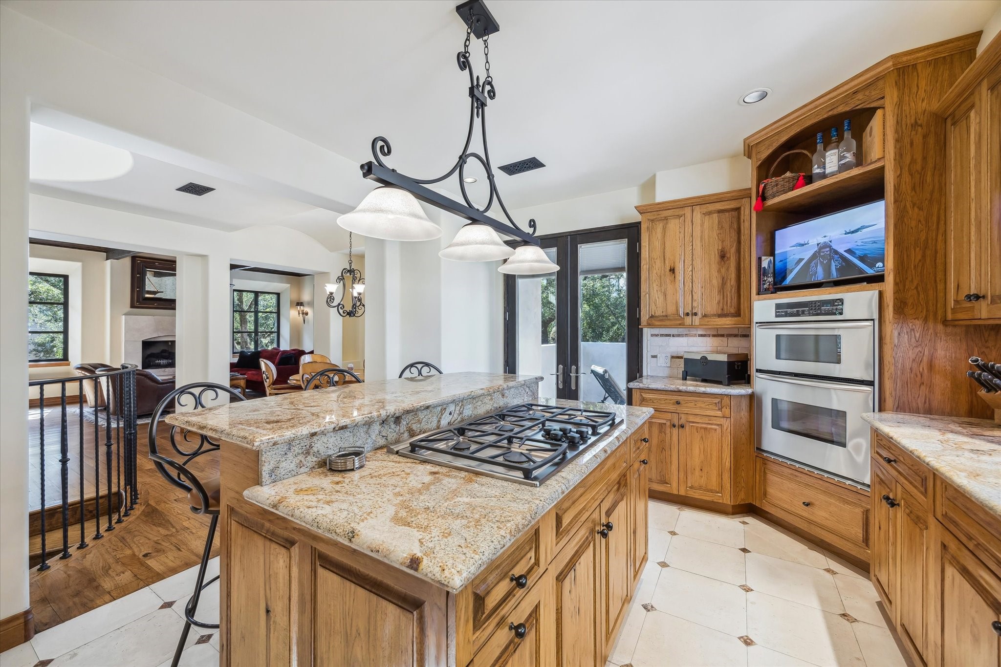 4320 Dickson Street Houston, TX 77007 - Photo 26 of 47 Gas cooktop and double ovens. Pecan cabinetry.