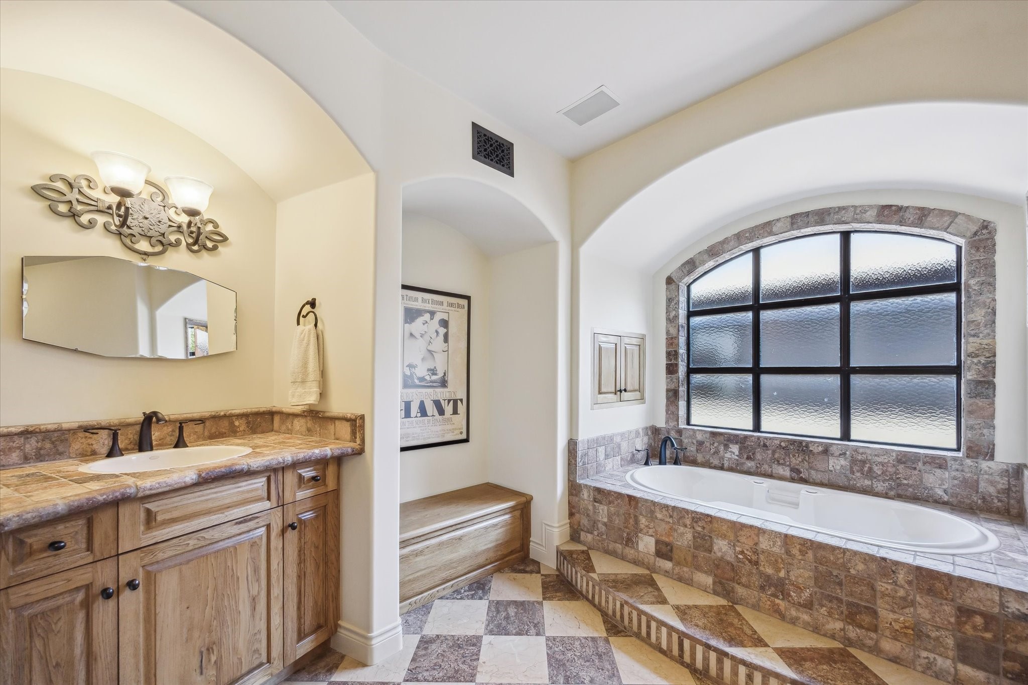 4320 Dickson Street Houston, TX 77007 - Photo 28 of 47 a spacious bathroom with a granite countertop tub sink and mirror